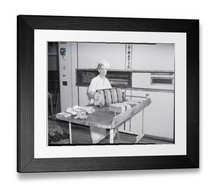 Framed Print : Man Taking Bread Loaves from Oven Framed Print : Man Taking Bread Loaves from Oven