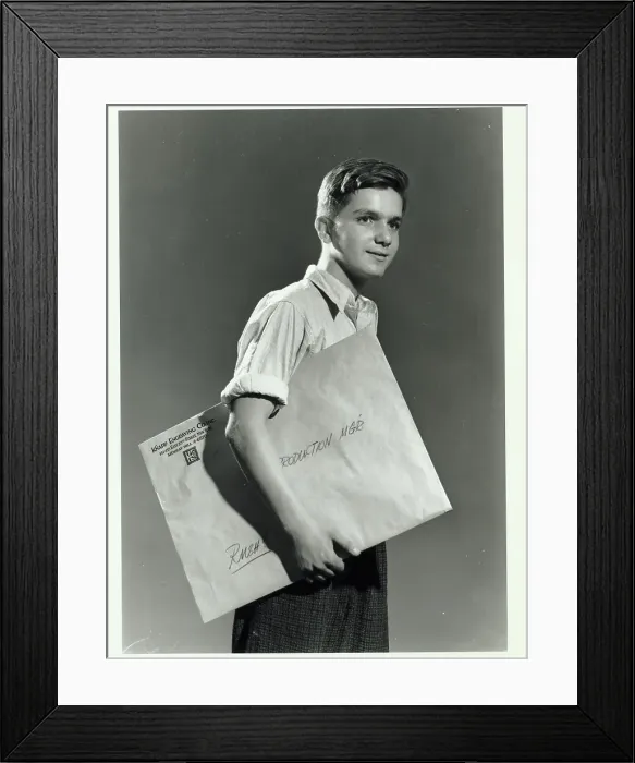 Framed Print : Man Carrying Package Framed Print : Man Carrying Package