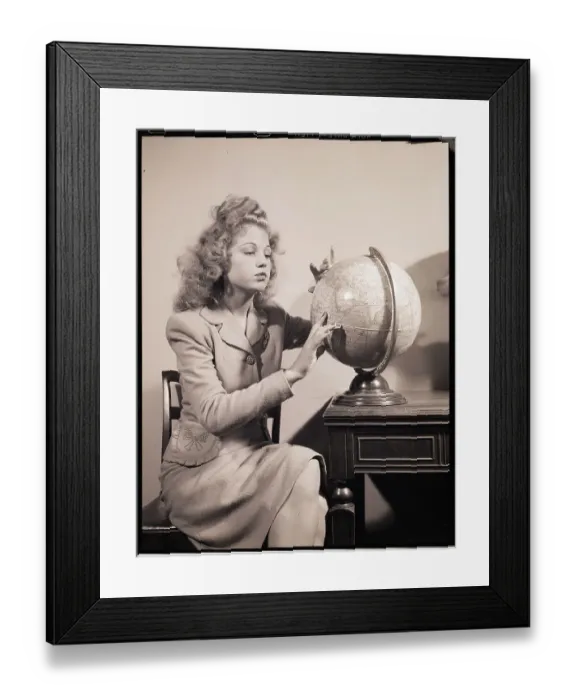 Framed Print : Seated Woman Spinning Globe
