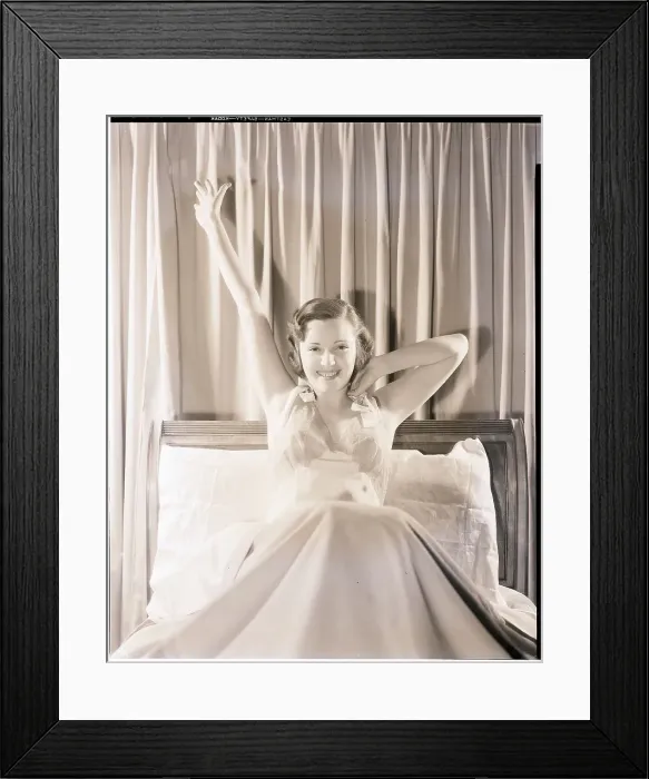 Framed Print : Woman Stretching in Bed Framed Print : Woman Stretching in Bed
