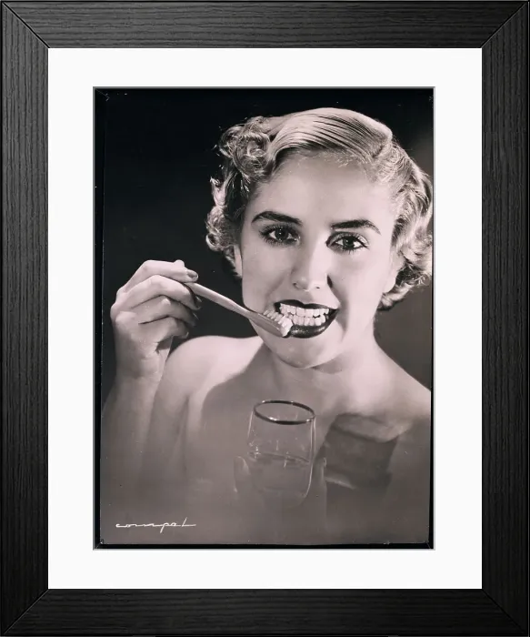 Framed Print : Woman Brushing Teeth Framed Print : Woman Brushing Teeth