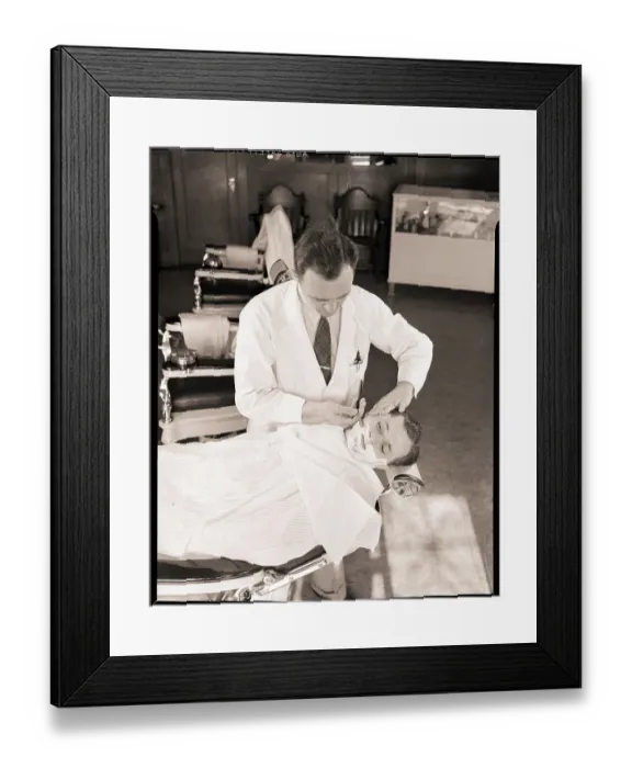 Framed Print : Man Being Shaved by Barber Framed Print : Man Being Shaved by Barber