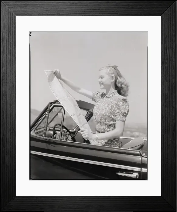 Framed Print : Young Woman Reading Road Map Framed Print : Young Woman Reading Road Map