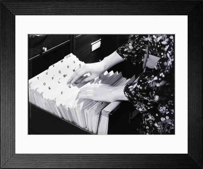 Framed Print : Woman Going Through Files Framed Print : Woman Going Through Files