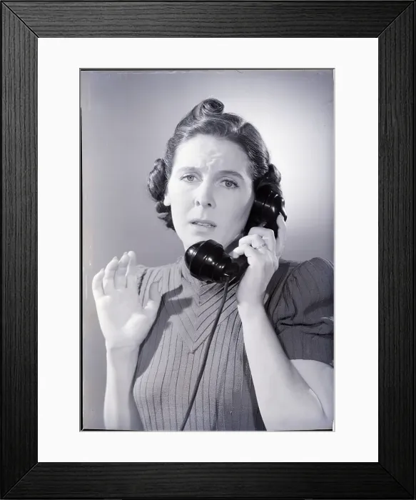 Framed Print : Anxious Woman On The Telephone