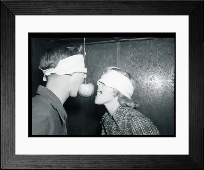 Framed Print : Party Game with an Apple on a String Framed Print : Party Game with an Apple on a String