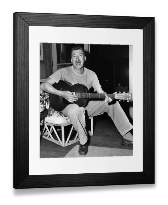 Framed Print : MacKinlay Kantor Singing and Playing Guitar Framed Print : MacKinlay Kantor Singing and Playing Guitar