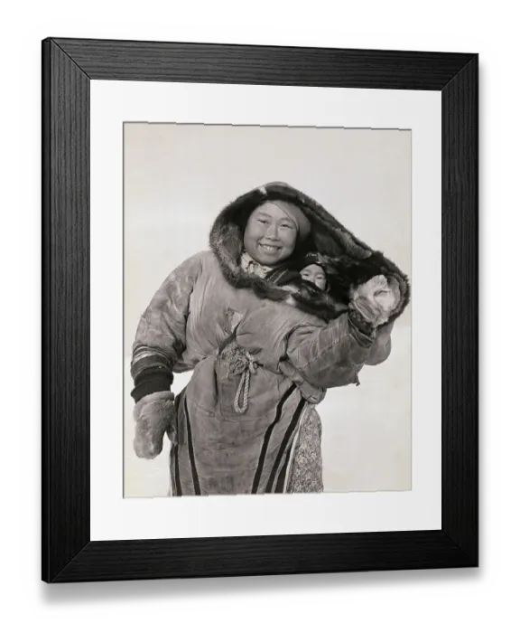 Framed Print : Smiling Inuit Mother Carrying Baby in Parka Hood Framed Print : Smiling Inuit Mother Carrying Baby in Parka Hood