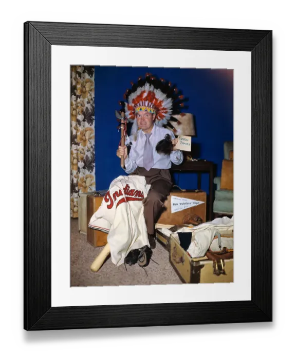 Framed Print : Bob Hope Wearing Native Headdress with Suitcases Framed Print : Bob Hope Wearing Native Headdress with Suitcases