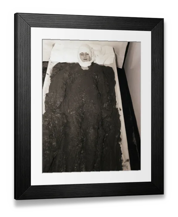 Framed Print : Woman Lying in Mud Bath