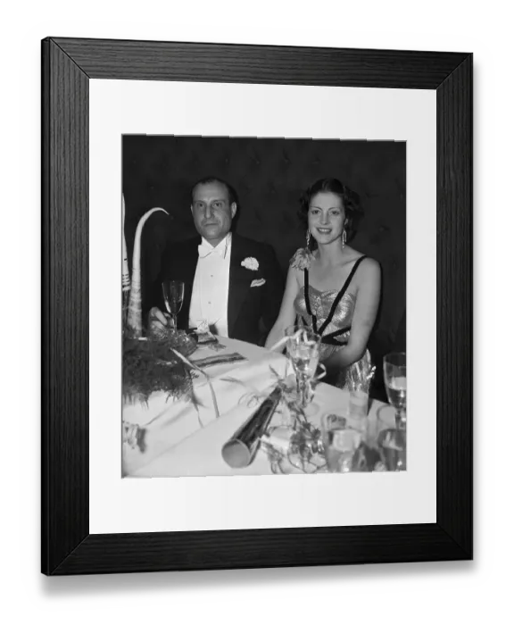 Framed Print : Two People Seated at Table at New Years Party Framed Print : Two People Seated at Table at New Years Party