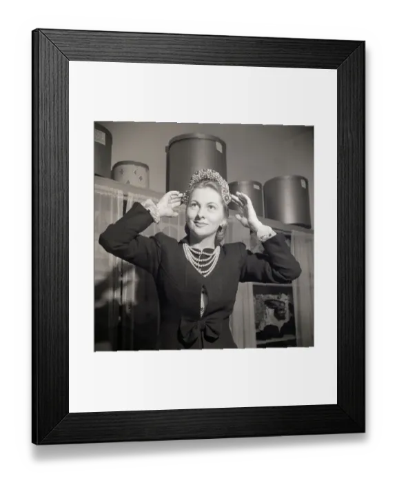 Framed Print : Joan Fontaine Tries On Beaded Hat