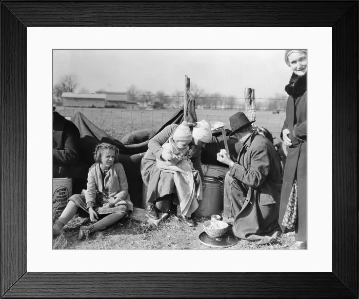 Framed Print : Family Sitting at Makeshift Camp Framed Print : Family Sitting at Makeshift Camp