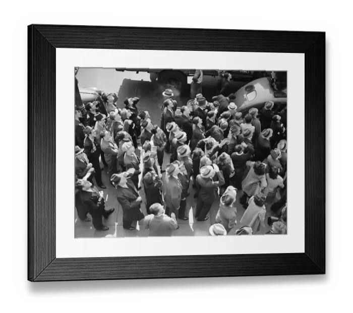 Framed Print : People on Street Look Up at Overhead Stunt