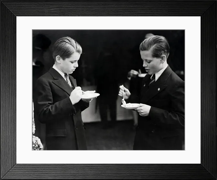 Framed Print : Robert Kennedy and friend eating from a bowl