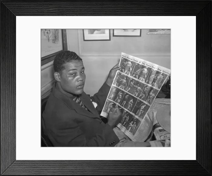 Framed Print : Joe Louis Observing Photographs Framed Print : Joe Louis Observing Photographs