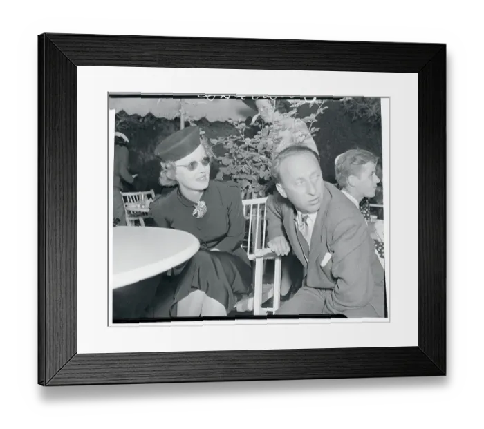 Framed Print : Bette Davis Chatting with Joe Pasternak Framed Print : Bette Davis Chatting with Joe Pasternak