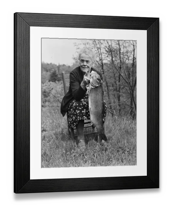 Framed Print : Elderly Woman Holding Fish She Caught Framed Print : Elderly Woman Holding Fish She Caught