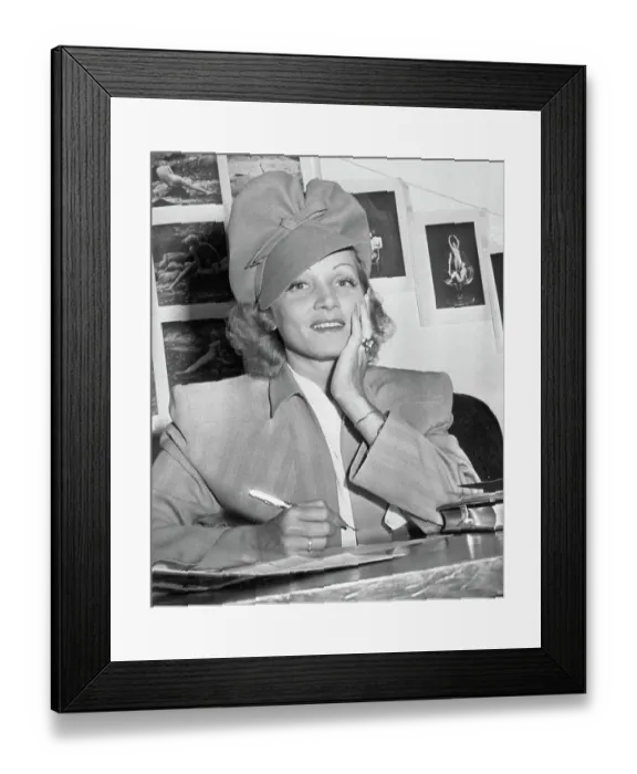 Framed Print : Marlene Dietrich Posing While Signing Citizenship Document Framed Print : Marlene Dietrich Posing While Signing Citizenship Document