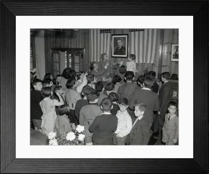 Framed Print : Guide of Children Pointing to Portrait on Wall Framed Print : Guide of Children Pointing to Portrait on Wall