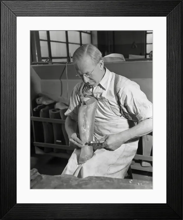 Framed Print : Worker Preparing Artificial Limb Framed Print : Worker Preparing Artificial Limb