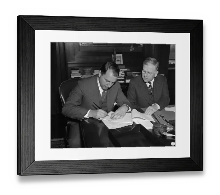 Framed Print : Harold Ickes Signing Contract with Juan Trippe