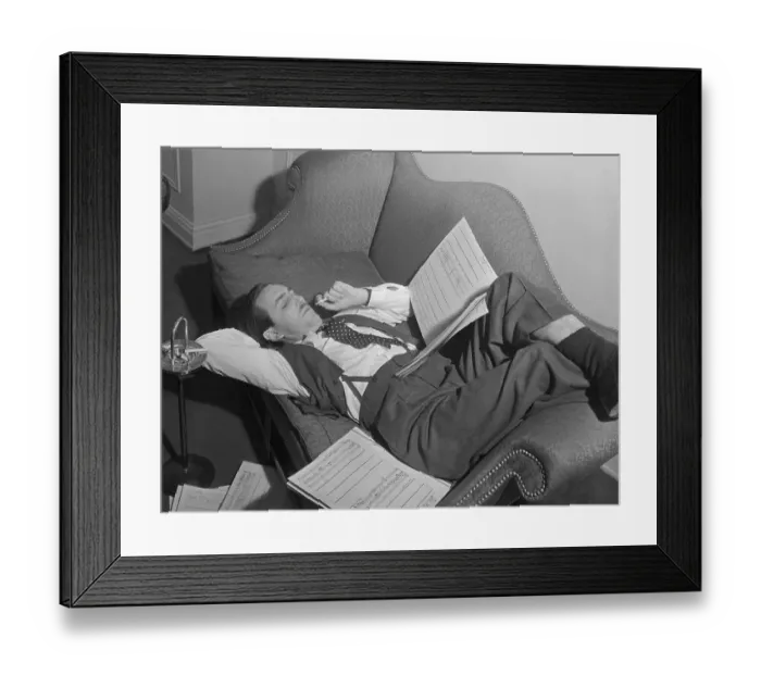 Framed Print : Walt Disney Lounging and Reading Script Framed Print : Walt Disney Lounging and Reading Script