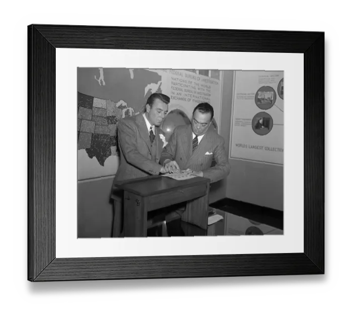 Framed Print : Hoover Taking George Brent's Fingerprints Framed Print : Hoover Taking George Brent's Fingerprints