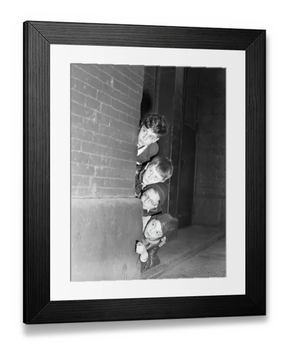 Framed Print : Four Children Peeking Around A Corner