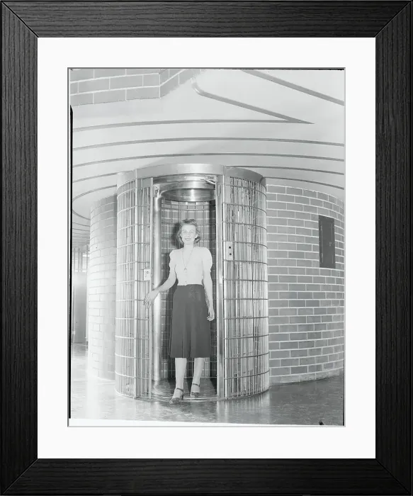 Framed Print : Young Woman Posing Inside Modern Elevator Framed Print : Young Woman Posing Inside Modern Elevator