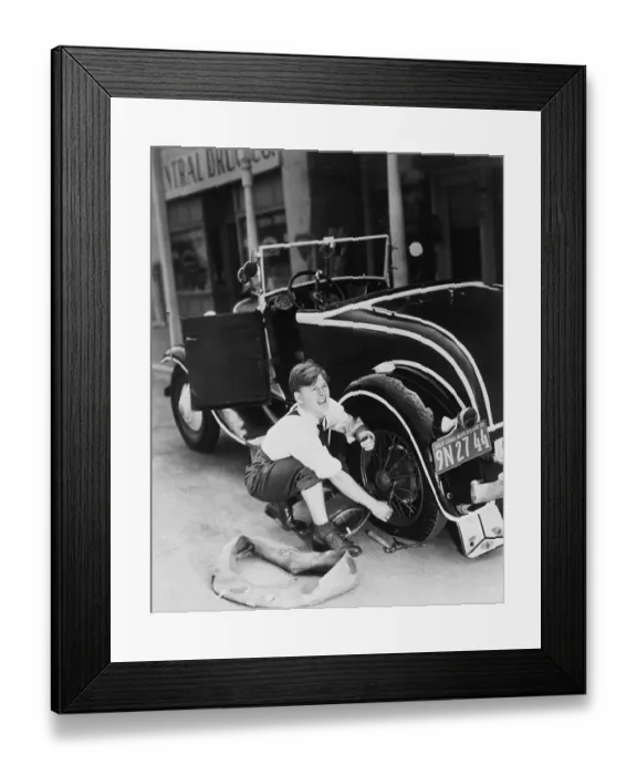 Framed Print : Mickey Rooney Working with Car Tire Framed Print : Mickey Rooney Working with Car Tire