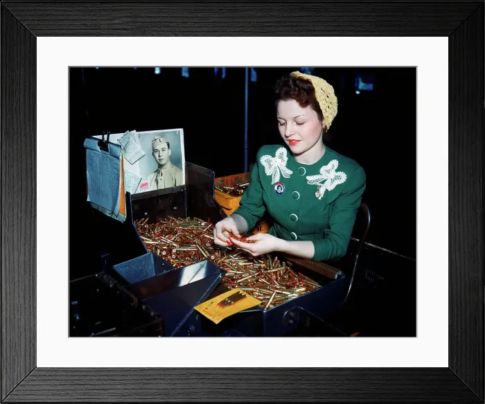 Framed Print : Woman Inspecting Bullets Framed Print : Woman Inspecting Bullets