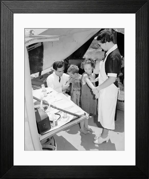Framed Print : Doctor and Nurse Vaccinate Migrant Children Framed Print : Doctor and Nurse Vaccinate Migrant Children