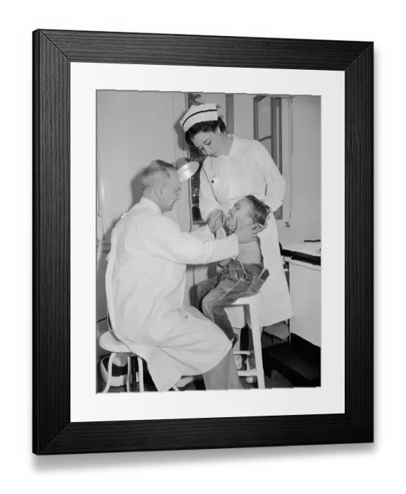 Framed Print : Doctor and Nurse Examine Young Migrant Worker Framed Print : Doctor and Nurse Examine Young Migrant Worker