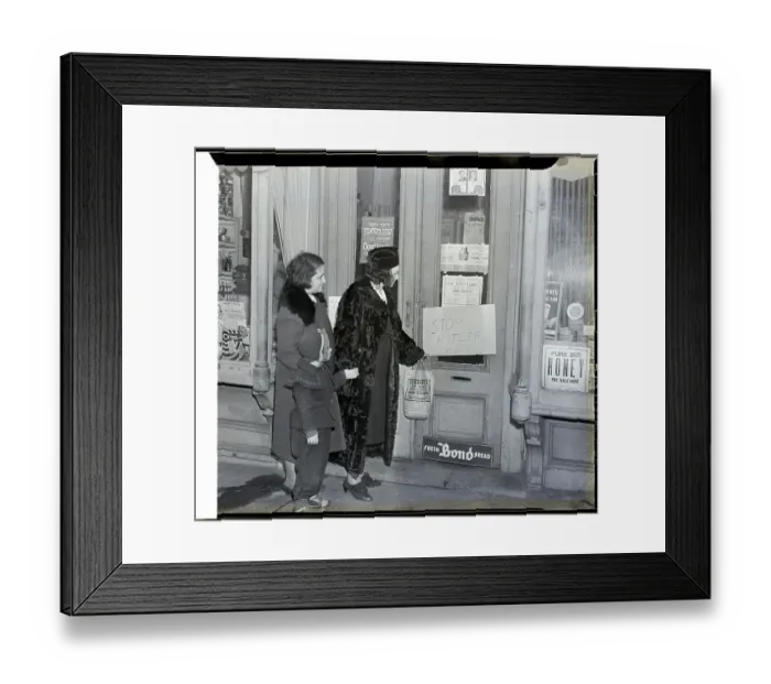 Framed Print : Shoppers Look At Sign On Door Framed Print : Shoppers Look At Sign On Door