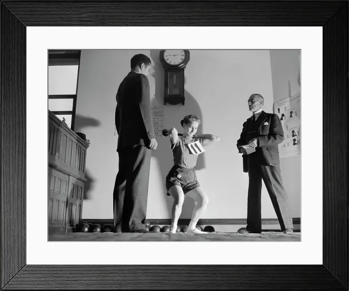 Framed Print : Judges Watch Woman Lift Weights