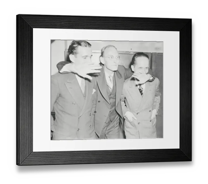 Framed Print : Spy Suspects Embracing at Courthouse Framed Print : Spy Suspects Embracing at Courthouse