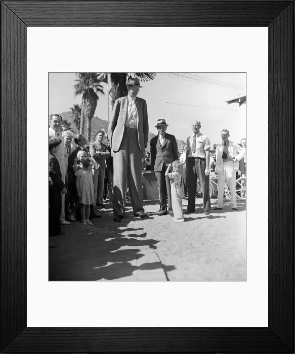 Framed Print : Girl Looking at Tall Man with Binoculars Framed Print : Girl Looking at Tall Man with Binoculars