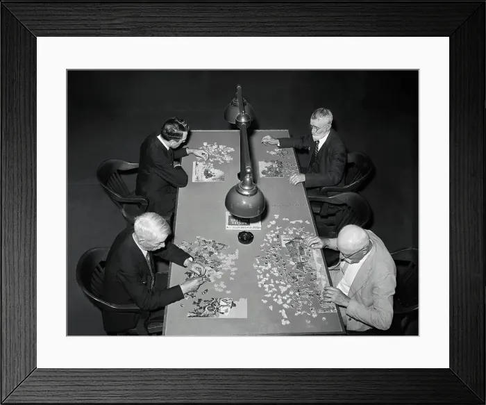 Framed Print : Men Concentrating on Jig-Saw Puzzles Framed Print : Men Concentrating on Jig-Saw Puzzles