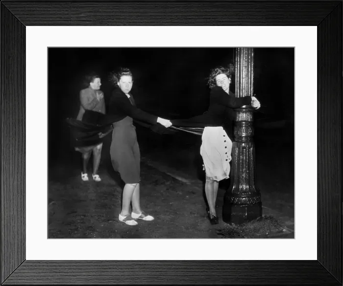 Framed Print : Women Holding Lamp Post In Wind Framed Print : Women Holding Lamp Post In Wind