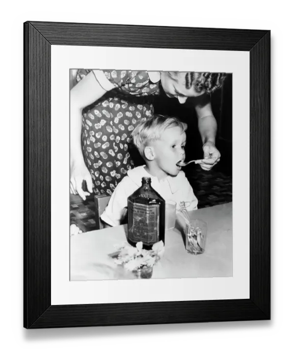 Framed Print : Little Boy Getting Dose of Cod Liver Oil Framed Print : Little Boy Getting Dose of Cod Liver Oil