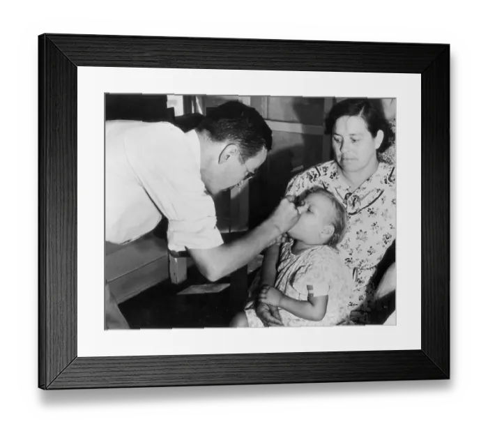 Framed Print : Doctor Examining a Child Framed Print : Doctor Examining a Child