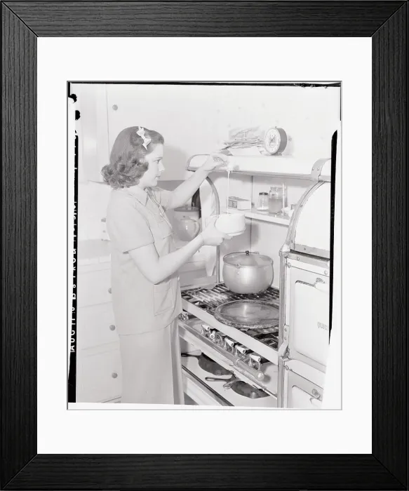 Framed Print : Judy Garland Cooking at Stove Framed Print : Judy Garland Cooking at Stove