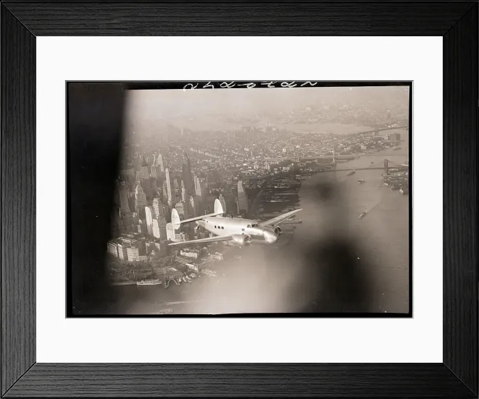Framed Print : Hughes Plane Flying Over Manhattan Framed Print : Hughes Plane Flying Over Manhattan