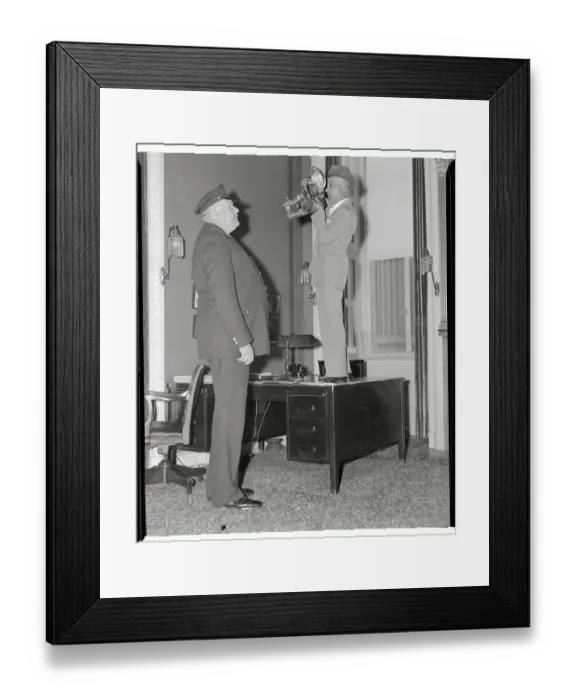 Framed Print : Photographer on Desk Photographing Cop Framed Print : Photographer on Desk Photographing Cop