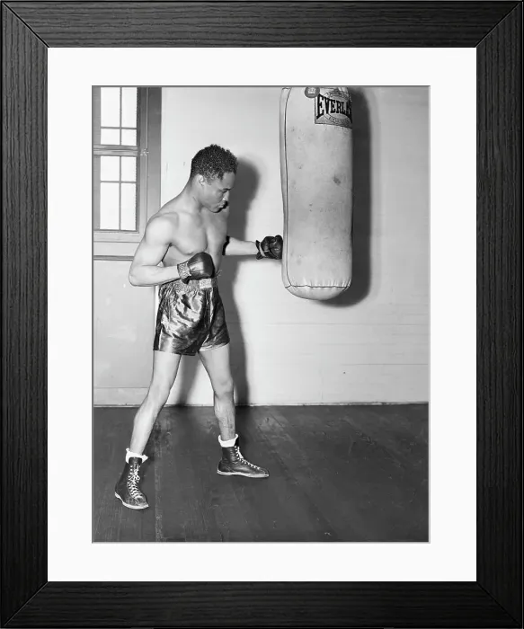 Framed Print : Henry Armstrong Hitting Heavy Bag