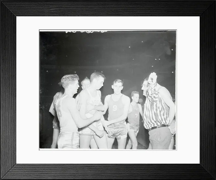 Framed Print : Referee Calming Basketball Players Framed Print : Referee Calming Basketball Players