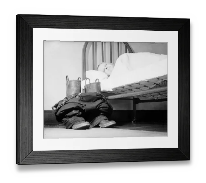 Framed Print : Fireman Sleeping with His Cloths Nearby