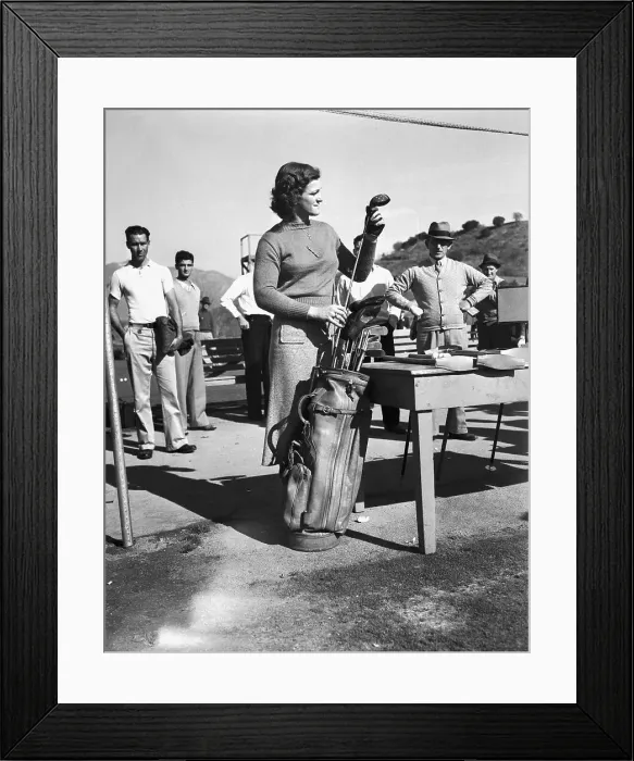 Framed Print : Babe Didrikson Examining Golf Clubs Framed Print : Babe Didrikson Examining Golf Clubs