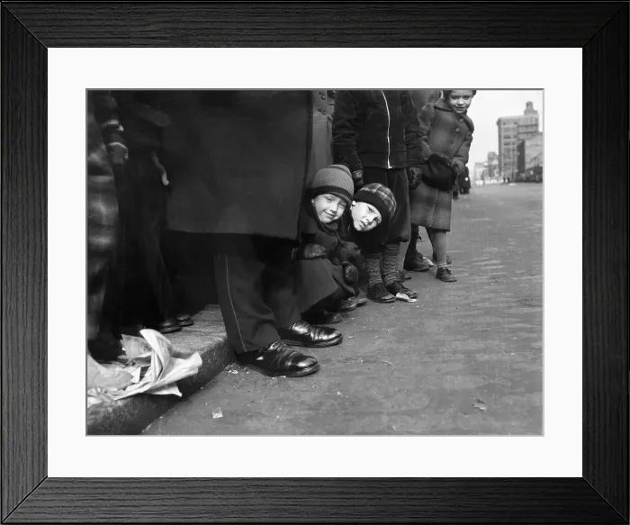 Framed Print : Boys (6-7) peeking out from behind crowd in street Framed Print : Boys (6-7) peeking out from behind crowd in street